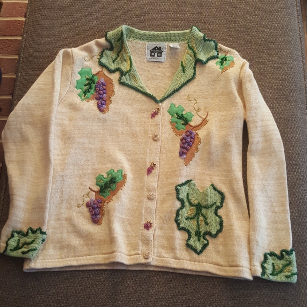 Button up sweater with raised designs.